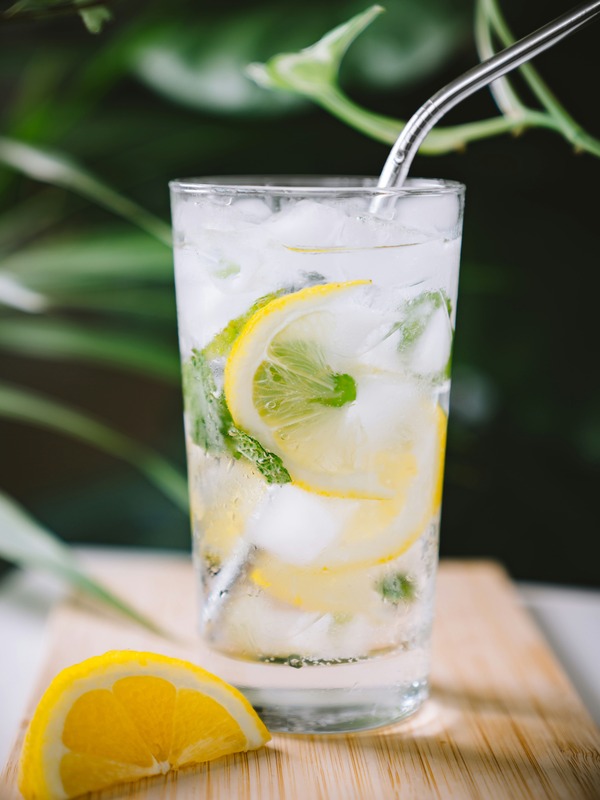 Drinking water with lemon from a glass